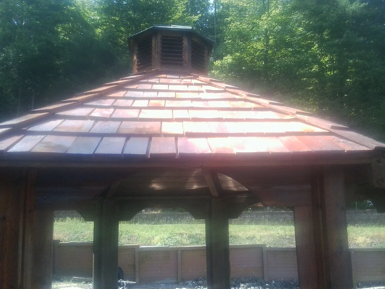 New cedar shake roof and cupola on a lakeside gazebo in Reidsville